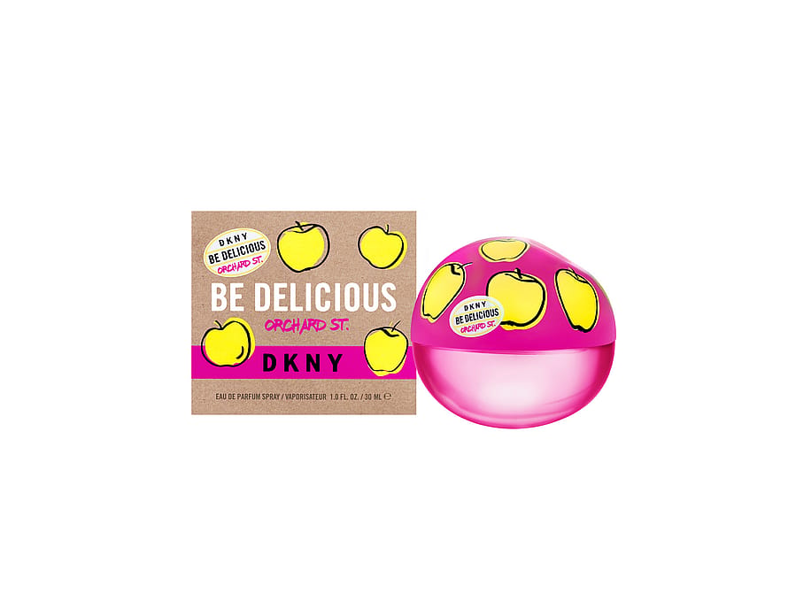Grön parfymflaska Dkny Be Delicious Orchard St, damparfym på vit bakgrund