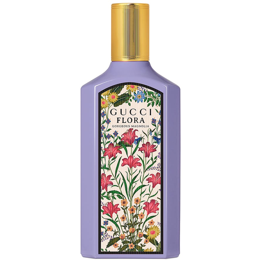 Gucci Flora Gorgeous Magnolia parfymflaska omgiven av blommor