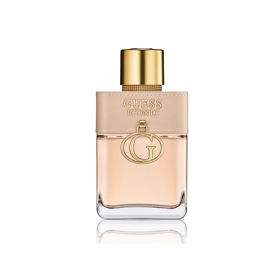 Gyllene parfymflaska för damparfym, Boucheron Quatre Iconic, mot ljus bakgrund