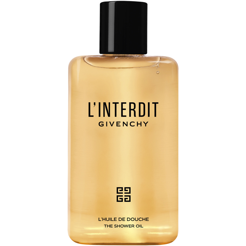 Transparent parfymflaska Givenchy L'Interdit mot ljus bakgrund