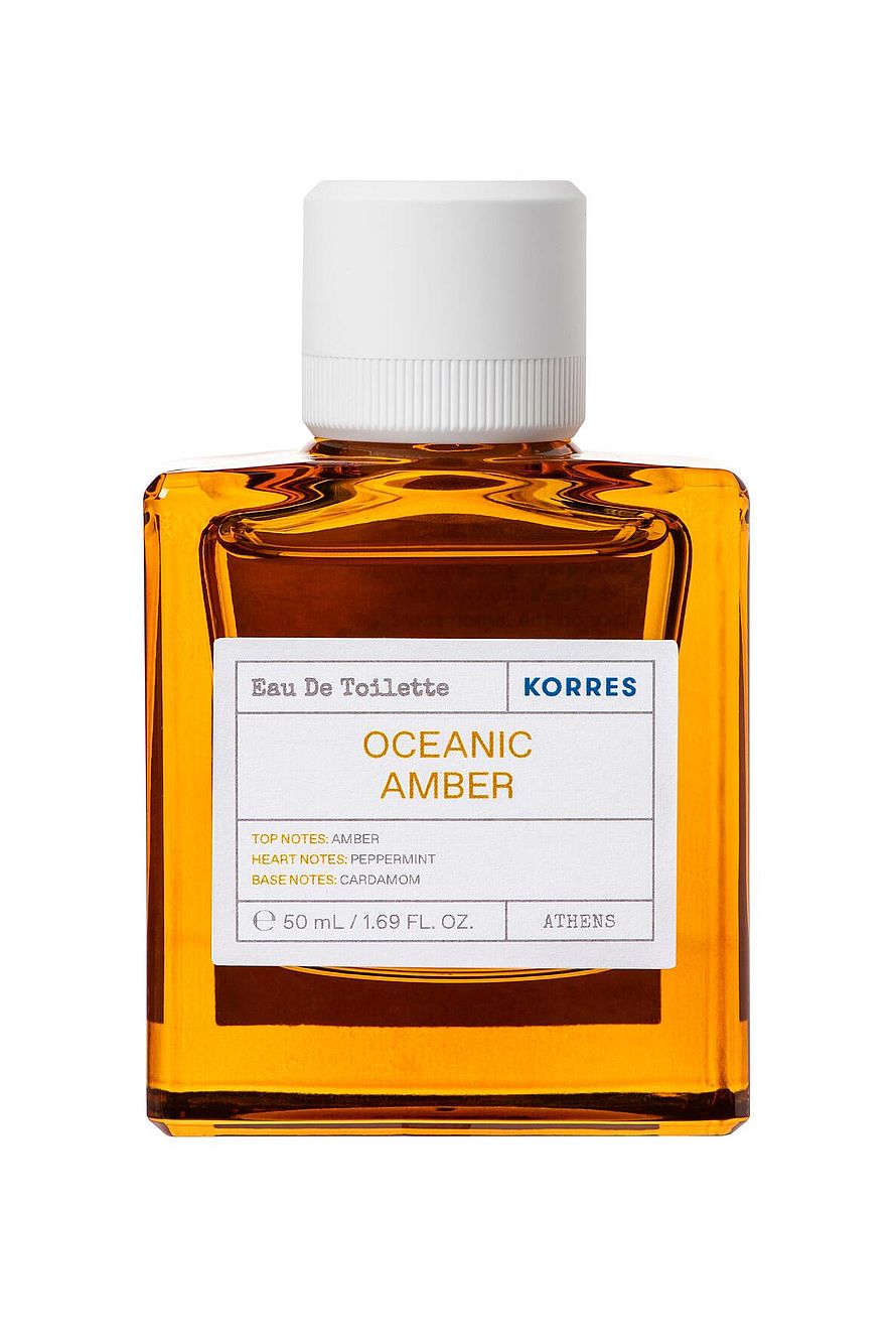 Parfymflaska Korres Oceanic Amber på ljus bakgrund, damparfym