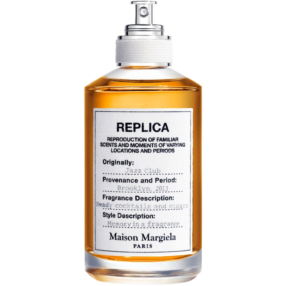 Maison Margiela Replica Jazz Club parfymflaska för herrar på träbord